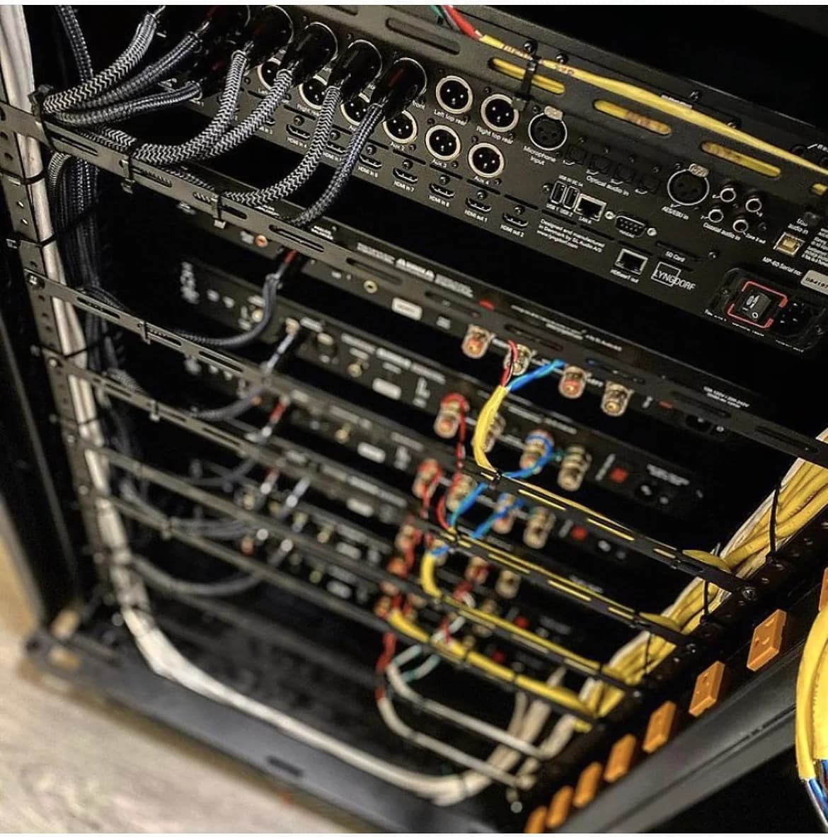 YCOP whole-home audio and video rack installation with organized equipment and cabling