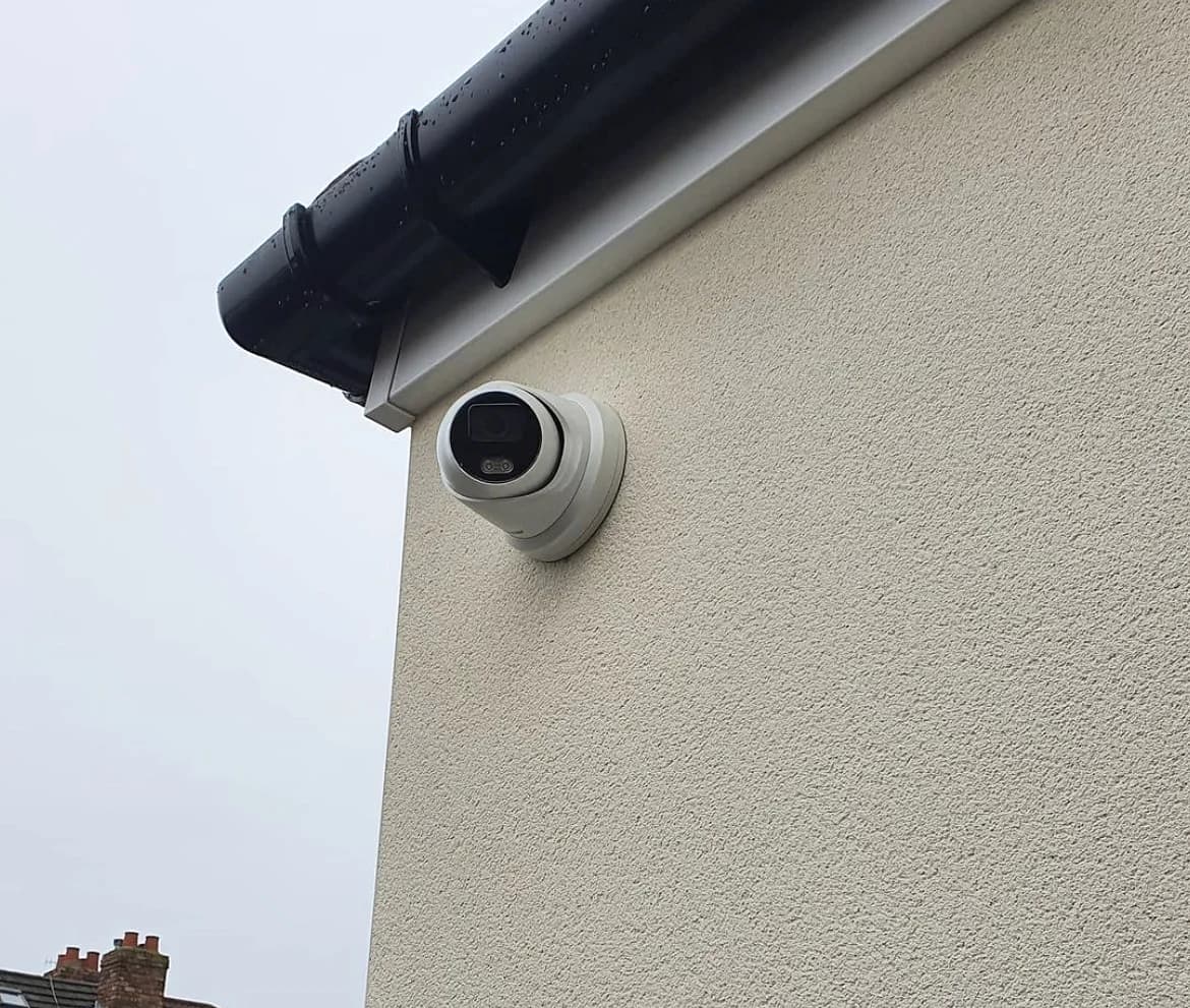 YCOP exterior security camera installed beneath a roof line