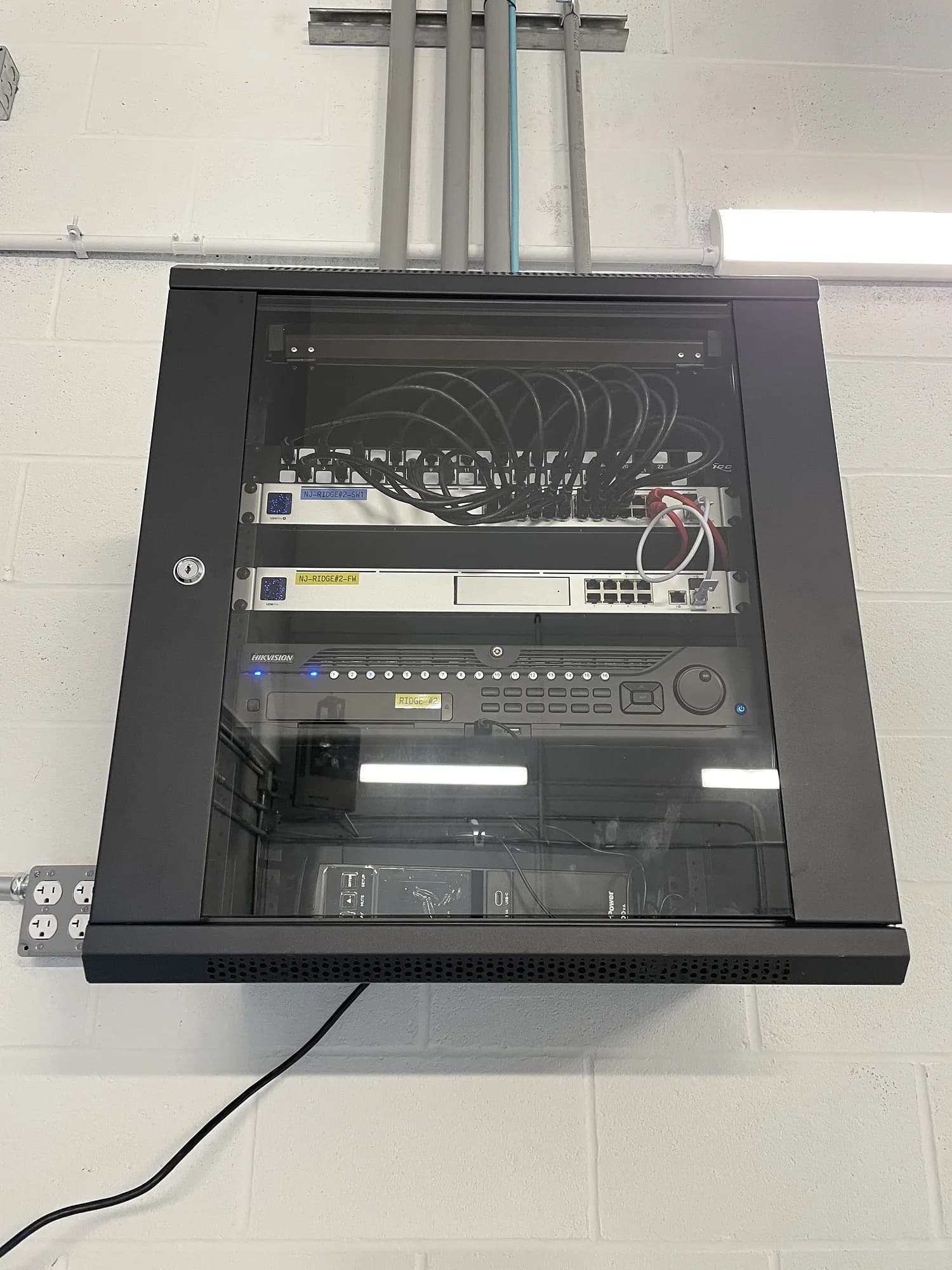 Commercial security monitoring room with a large multi-display camera wall installed by YCOP