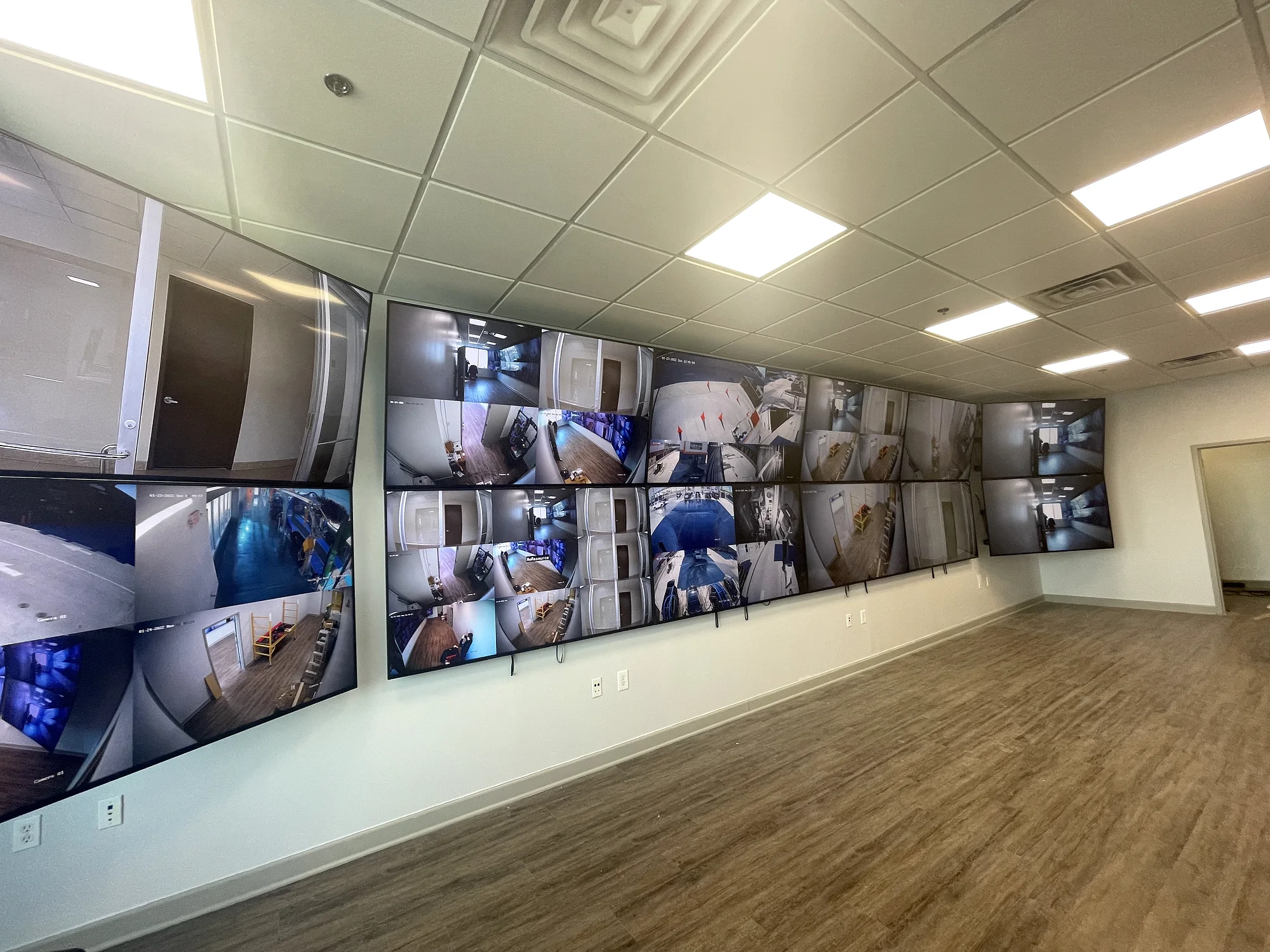 Wall-mounted commercial network and camera rack installed by YCOP
