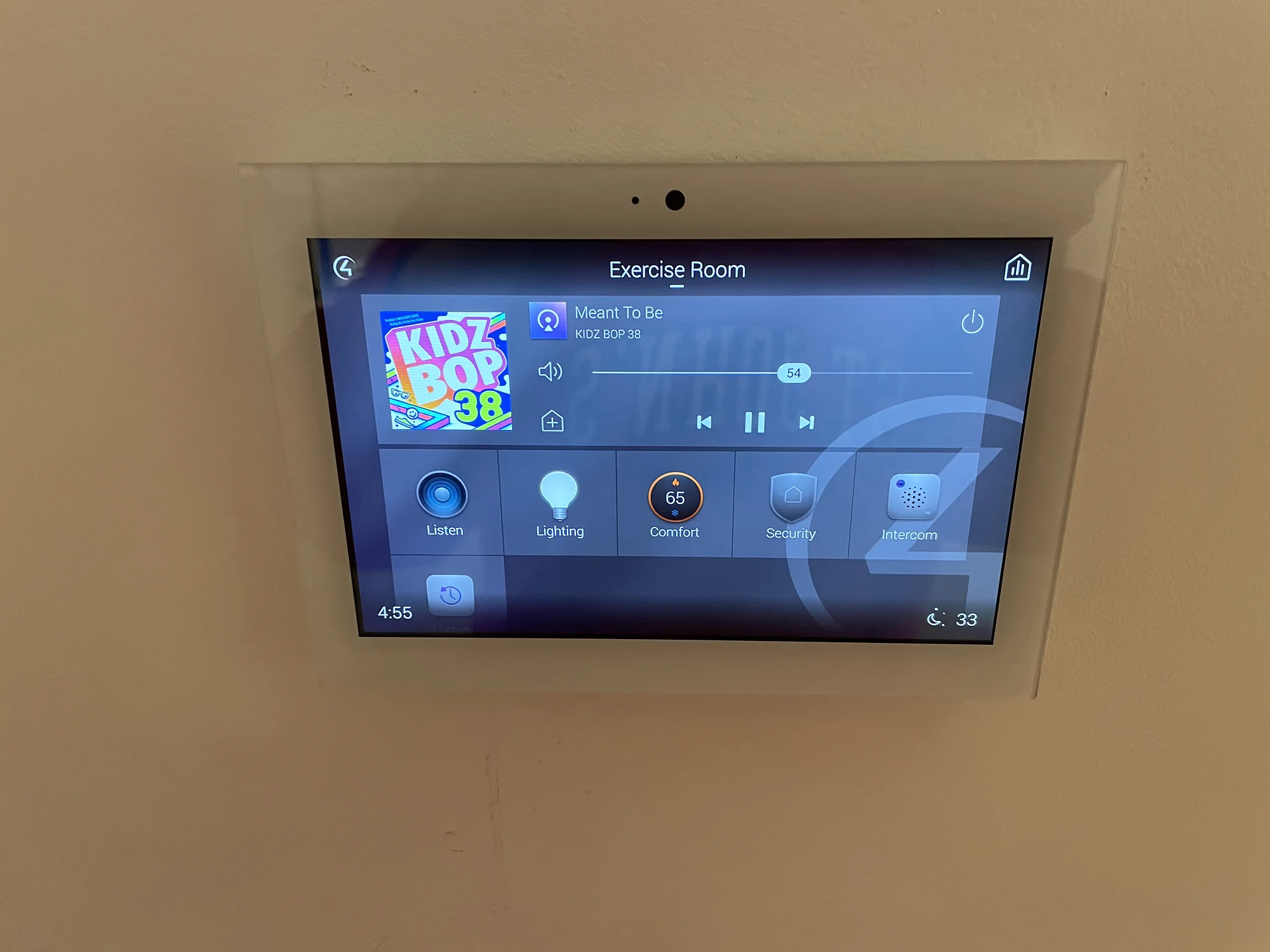 Wall-mounted Control4 touchscreen installed by YCOP