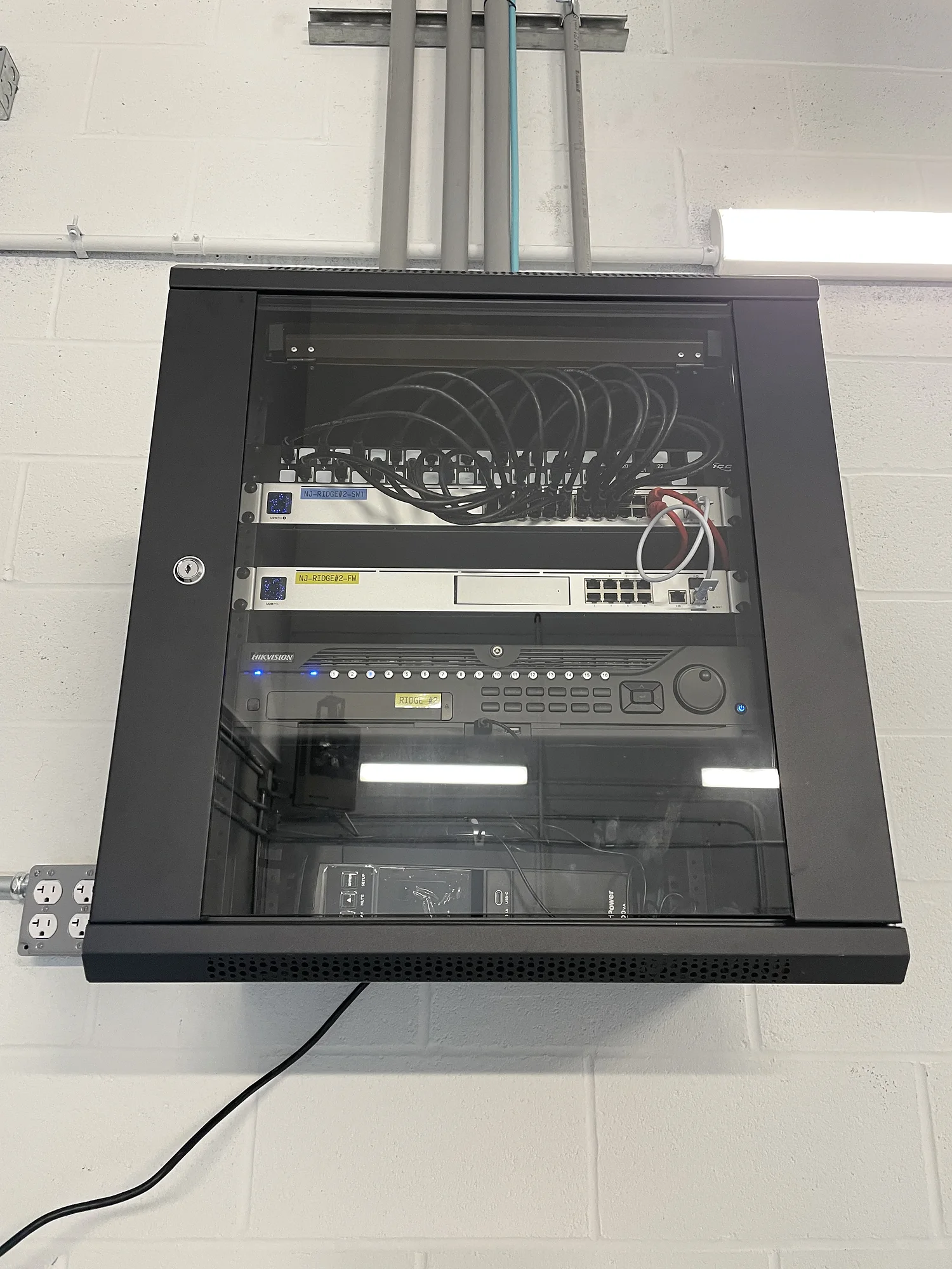 Commercial security monitoring room with a large multi-display camera wall installed by YCOP